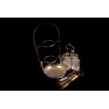 A collection of silver plated items, including a cake stand, toast rack, dishes, flatware and