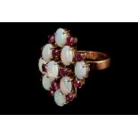 An opal and garnet dress ring, the nine oval cut opals with small round cut garnets set between,