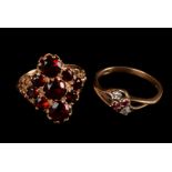 A 9ct gold and garnet dress ring, the multiple garnets to top in the from of a diamond, the