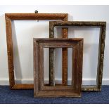 A group of three vintage pine frames, one carved with repeating flower head design, another carved