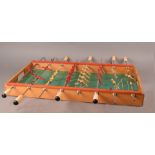 A.R.C.O. table football game, rectangular shape with red and cream plastic figures, 70cm