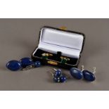 Five pairs of modern cufflinks, including a gilt pair with synthetic emeralds, in a box, two pairs