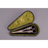 A good pair of cased late Victorian silver grape shears by George Jackson & David Fullerton,