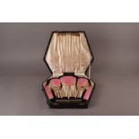 A pretty Art Deco silver and pink enamel dressing table set, presented in a fitted case, dated