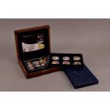 A collection of modern proof coins, including a 2011 Royal Mint UK Executive Proof Set, two five