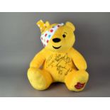 A Large Pudsey teddy bear, signed by Natasha Raskin Sharp and out celebrity contentants, BBC Radio 1