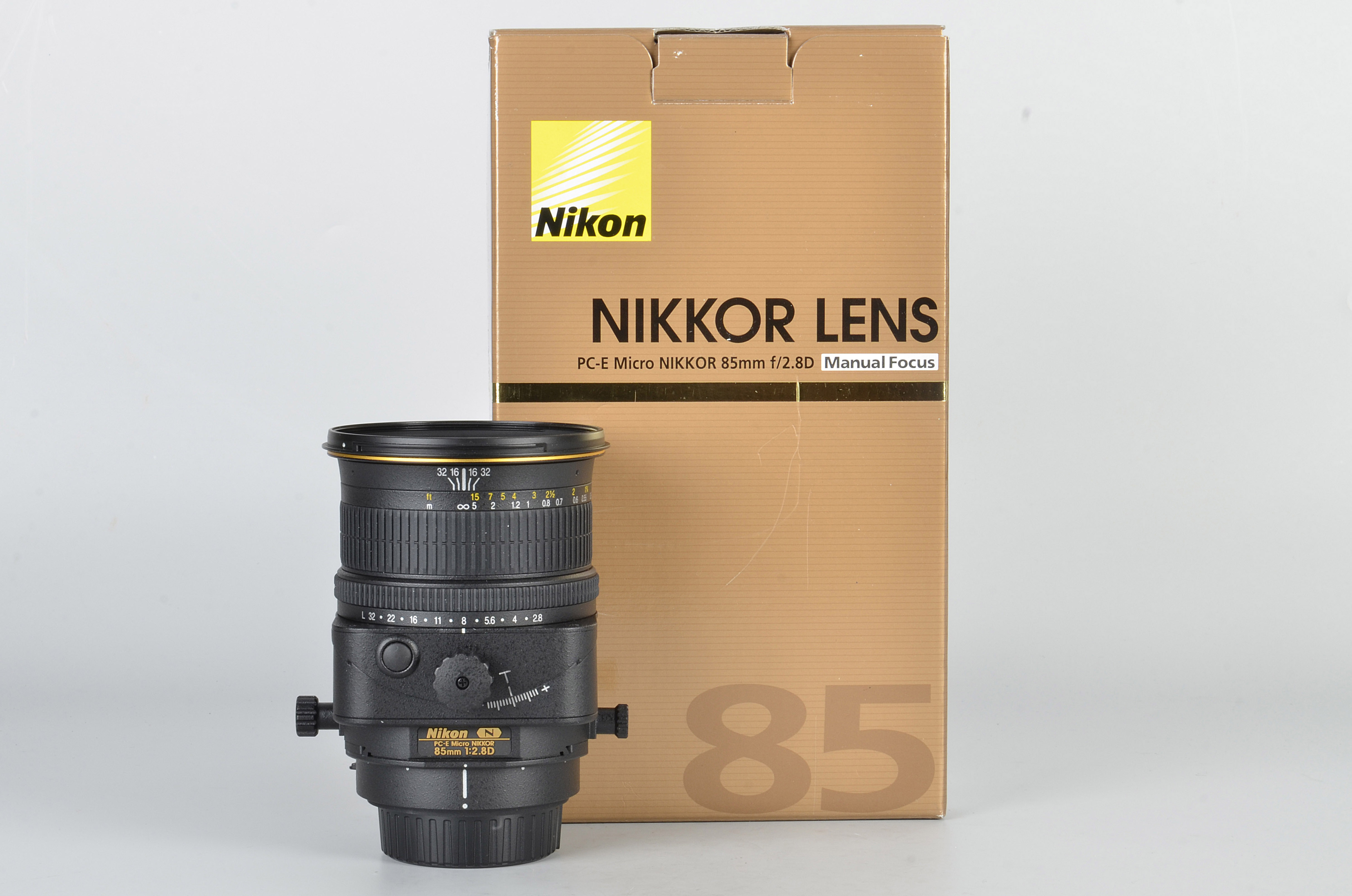 A Nikon PC-E Micro-Nikkor f/2.8 85mm Lens, black, serial no. 205976, body, E, elements, E, in