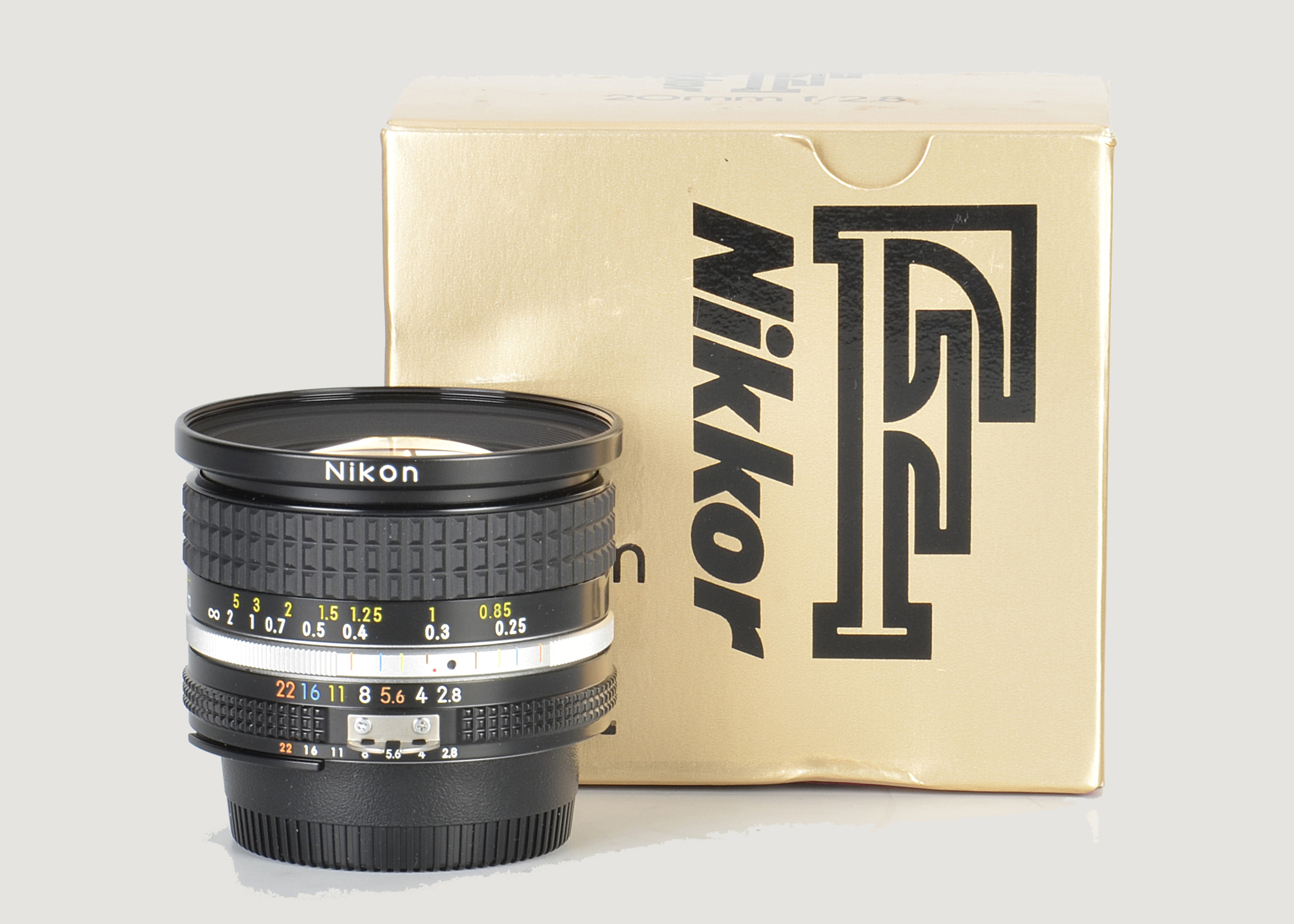 A Nikon AIS f/2.8 20mm Lens, black, serial no. 241743, body, E, elements, VG-E, in maker’s box