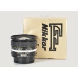 A Nikon AIS f/2.8 20mm Lens, black, serial no. 241743, body, E, elements, VG-E, in maker’s box