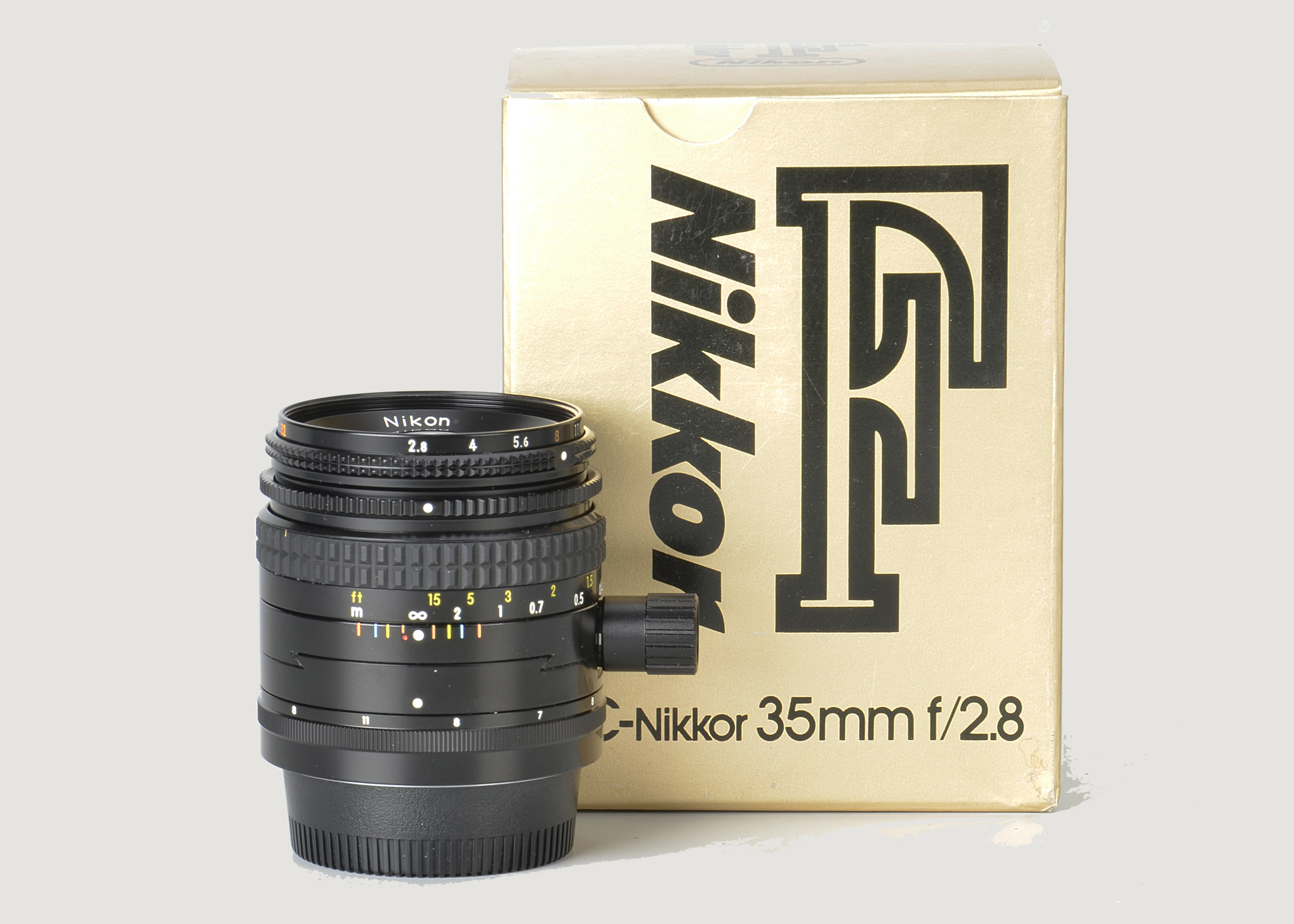 A Nikon PC-Nikkor f/2.8 35mm Lens, black, serial no. 186661, body, E, elements, VG-E, in maker’s