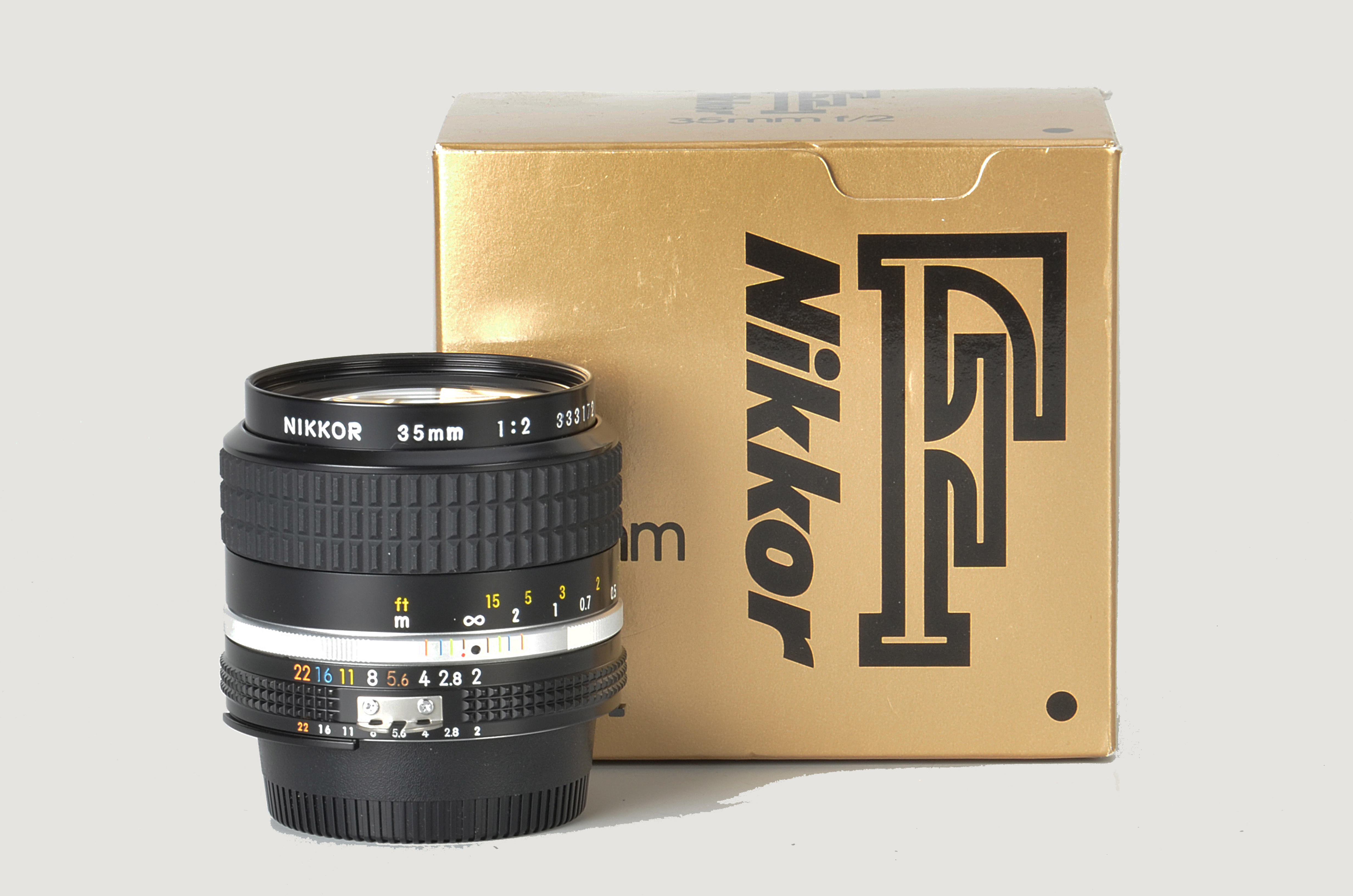 A Nikon AIS f/2 35mm Lens, black, serial no. 333172, body, E, elements, E, in maker’s box