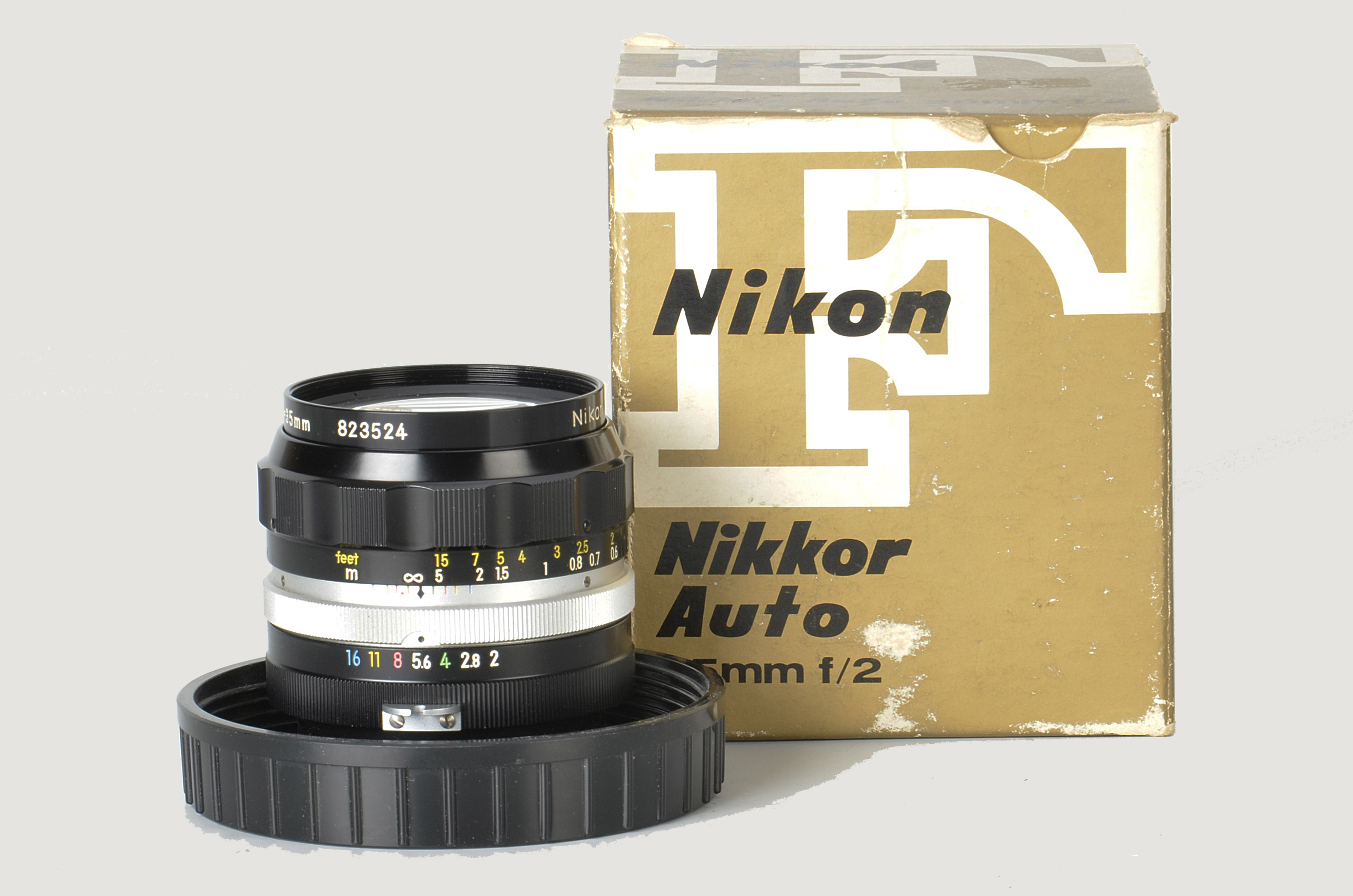 A Nikon Nikkor-O f/2 35mm Lens, black, serial no. 823524, body, E, elements, VG-E, in maker’s bubble