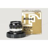 A Nikon Nikkor-O f/2 35mm Lens, black, serial no. 823524, body, E, elements, VG-E, in maker’s bubble