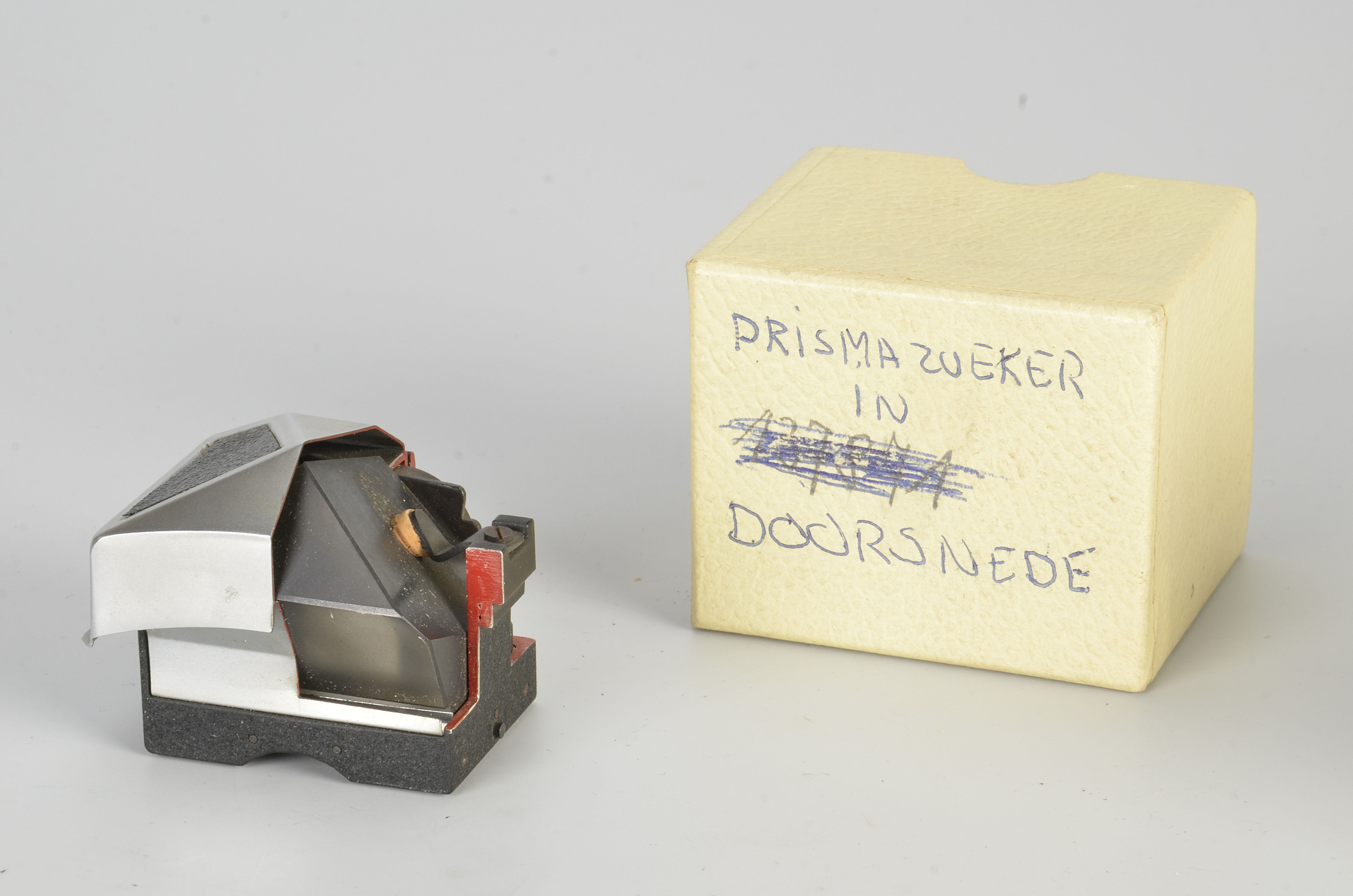 An Ihagee Exakta Prism Cut-Away Model, with cut-away sections showing internals, in maker’s boxed