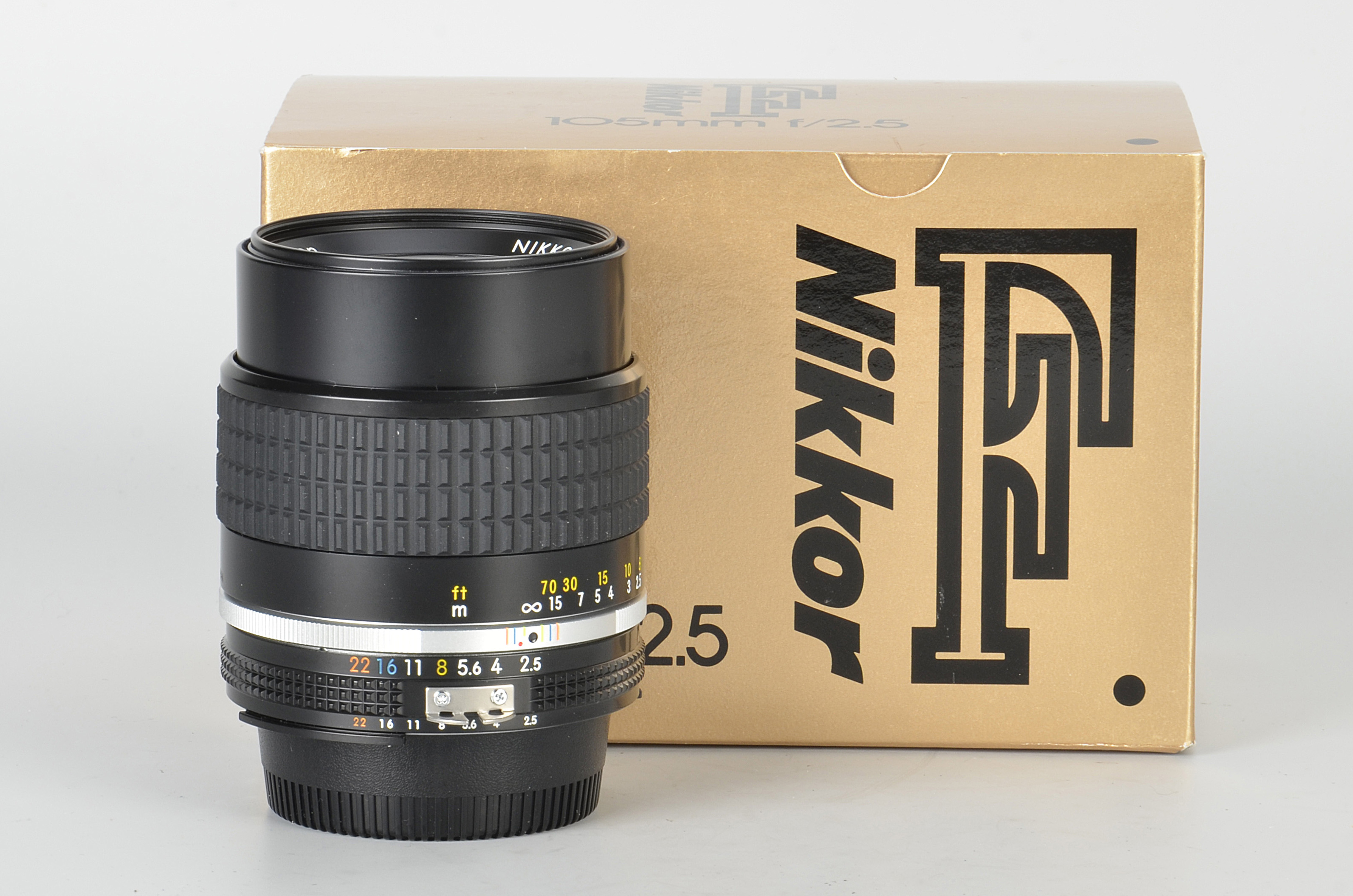 A Nikon AIS f/2.5 105mm Lens, black, serial no. 1052891, body, E, elements, E, in maker’s box