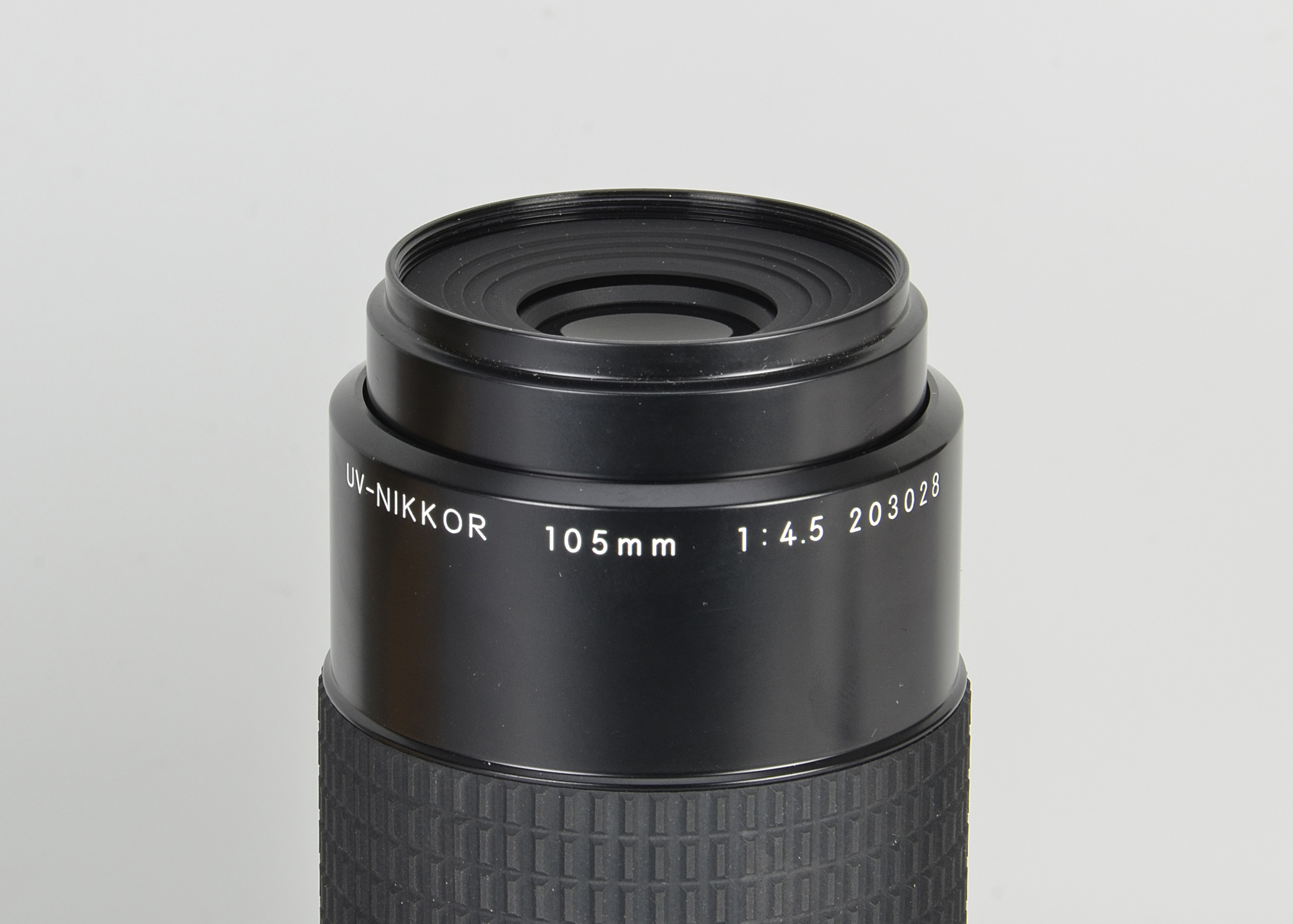 A Nikon UV-Nikkor f/4.5 105mm Lens, black, serial no. 203028, body, E, elements, E, together with - Image 2 of 2