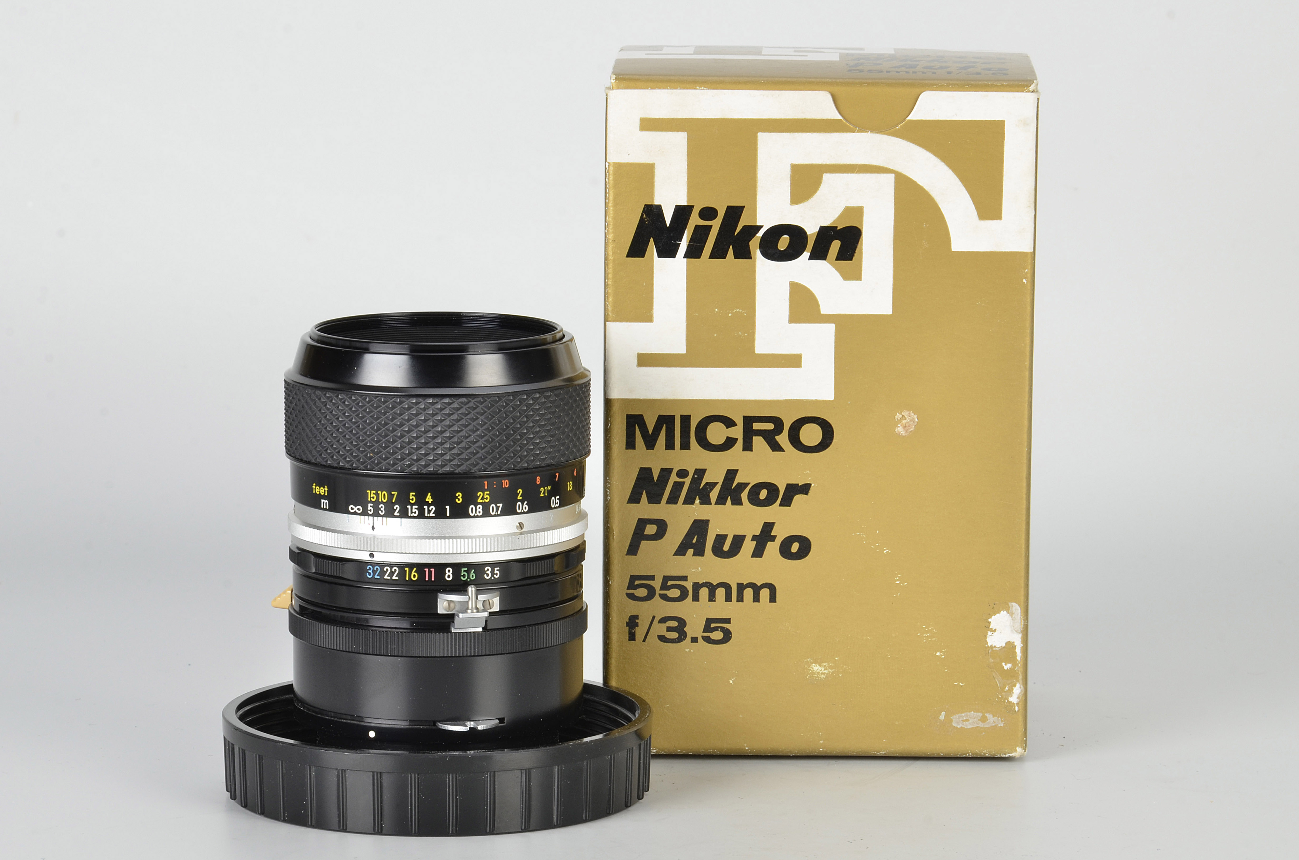 A Nikon Micro-Nikkor-P f/3.5 55mm Lens, black, serial no. 724071, body, E, elements, VG, some very