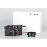 A Leica M6 TTL Rangefinder Camera, black, serial no. 2736268, with Leitz Summilux-M f/1.4 50mm lens,