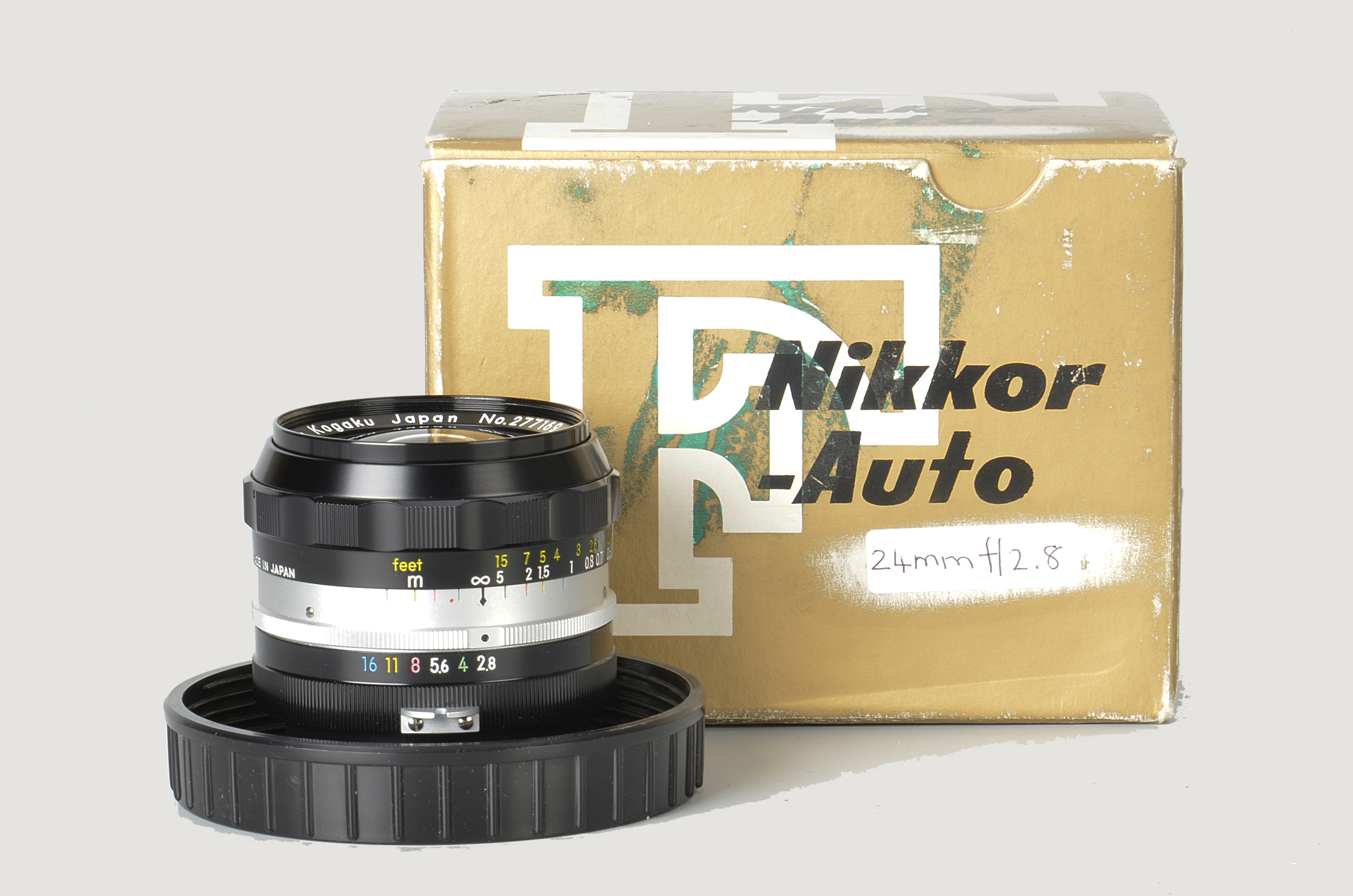 A Nikon Nikkor-N f/2.8 24mm Lens, black, serial no. 277169, body, E, elements, VG-E, in maker’s
