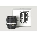 A Nikon AI f/2.8 35mm Lens, black, serial no. 815239, body, E, elements, VG-E, in maker’s box