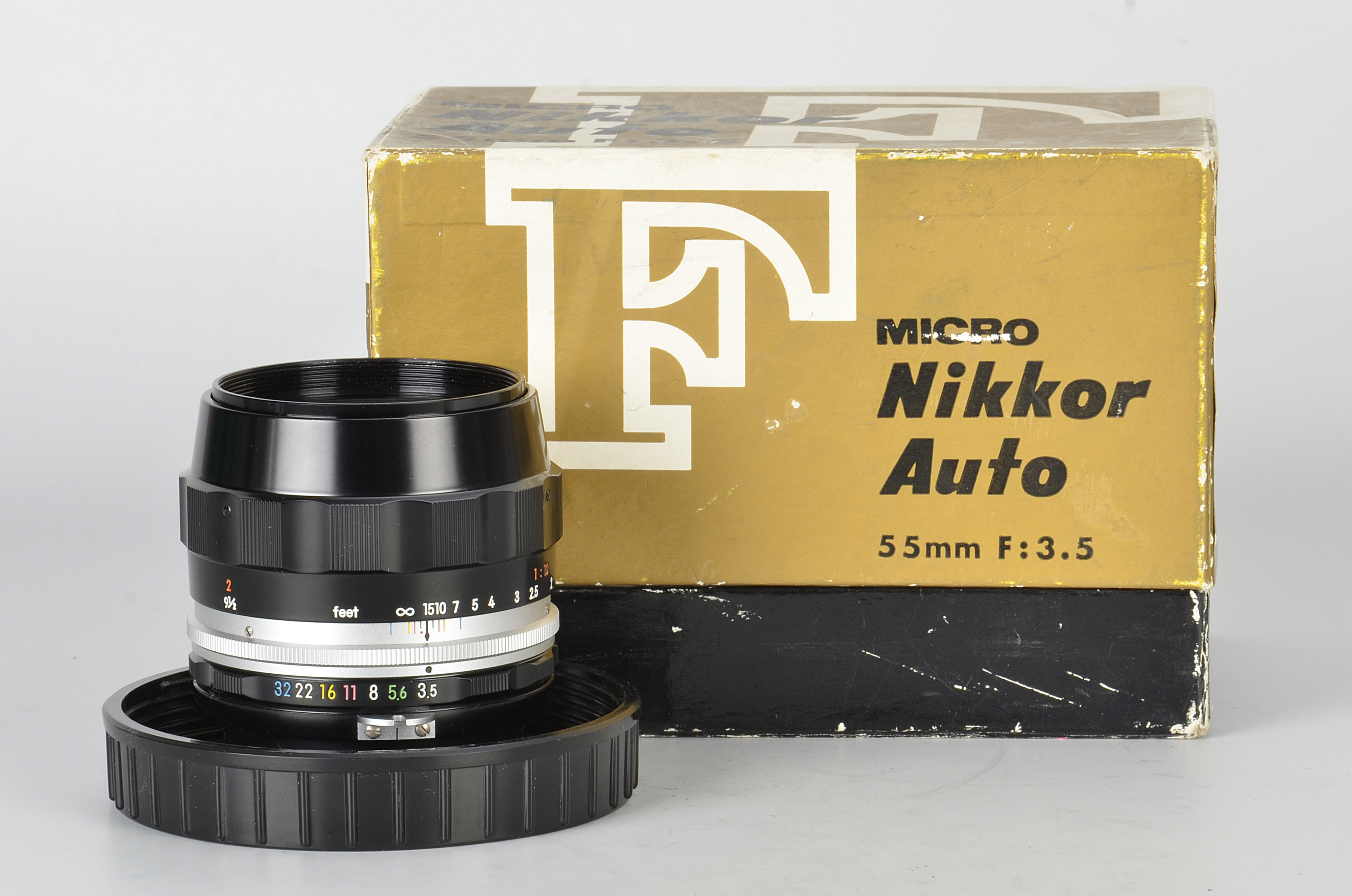 A Nikon Micro-Nikkor f/3.5 55mm Lens, black, serial no. 256697, body, E, elements, VG-E, in maker’