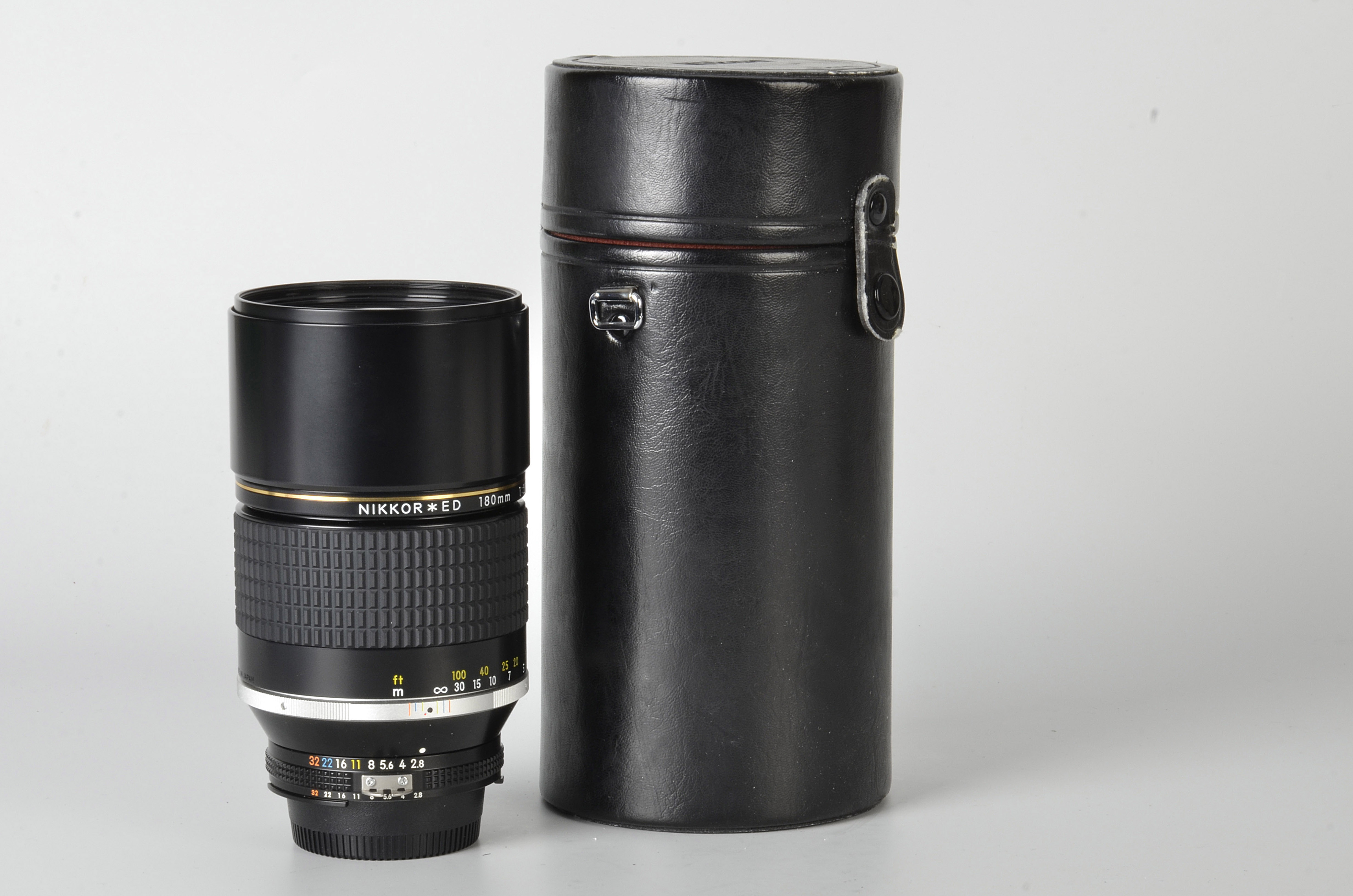 A Nikon AIS ED f/2.8 180mm Lens, black, serial no. 439008, body, E, elements, E, in maker’s case