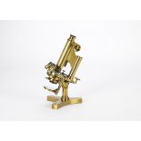 An R & J Beck Ltd lacquered brass Compound Monocular Microscope, serial no. 20788, with flat