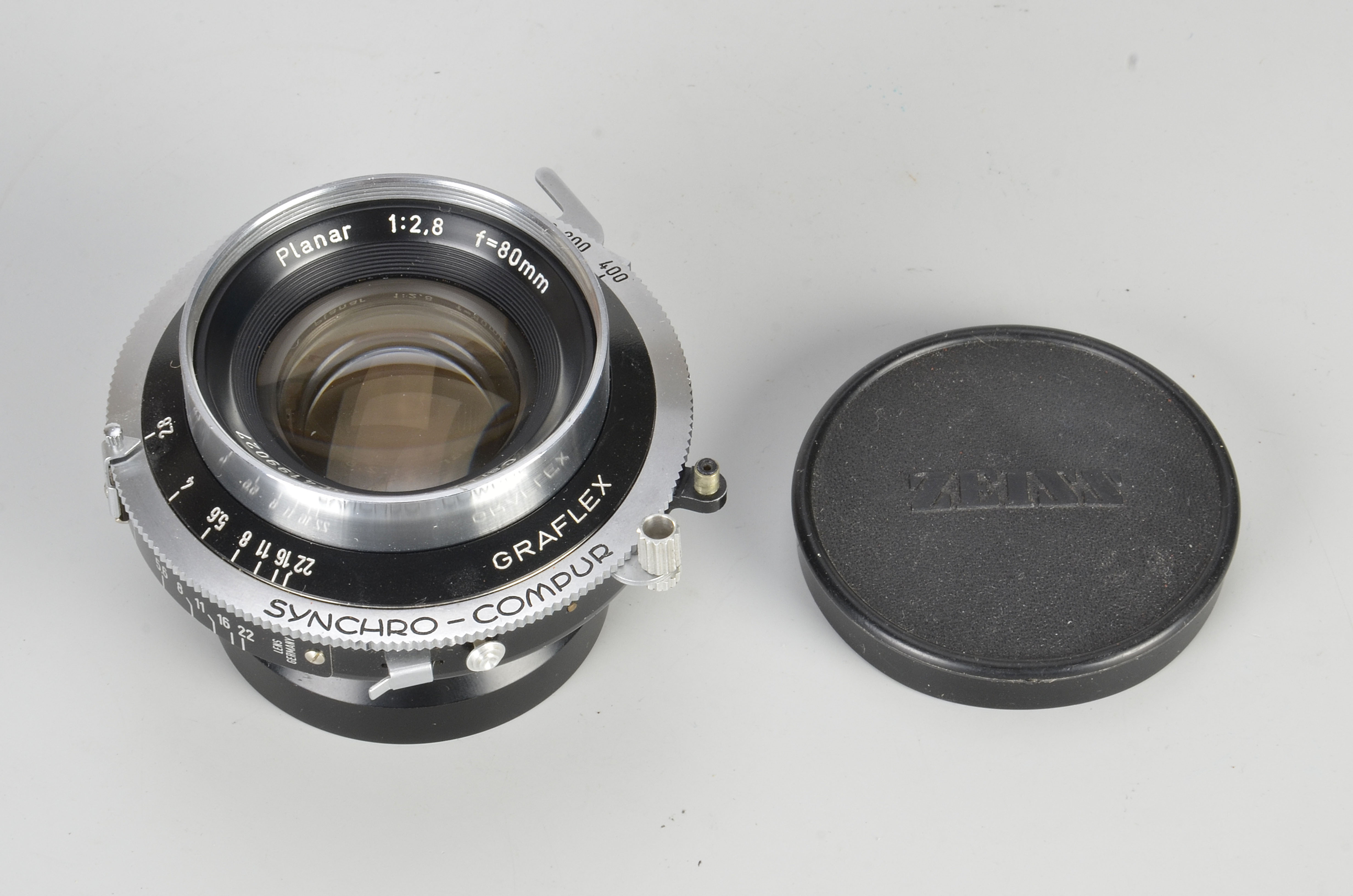A Carl Zeiss Planar f/2.8 80mm Lens, serial no. 4199027, in Synchro-Compur shutter, body, VG,