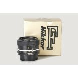 A Nikon AI f/2.8 28mm Lens, black, serial no. 565562, body, E, elements, VG, in maker’s box