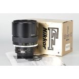 A Nikon AIS f/2 135mm Lens, black, serial no. 216246, body, E, elements, E, in maker’s box