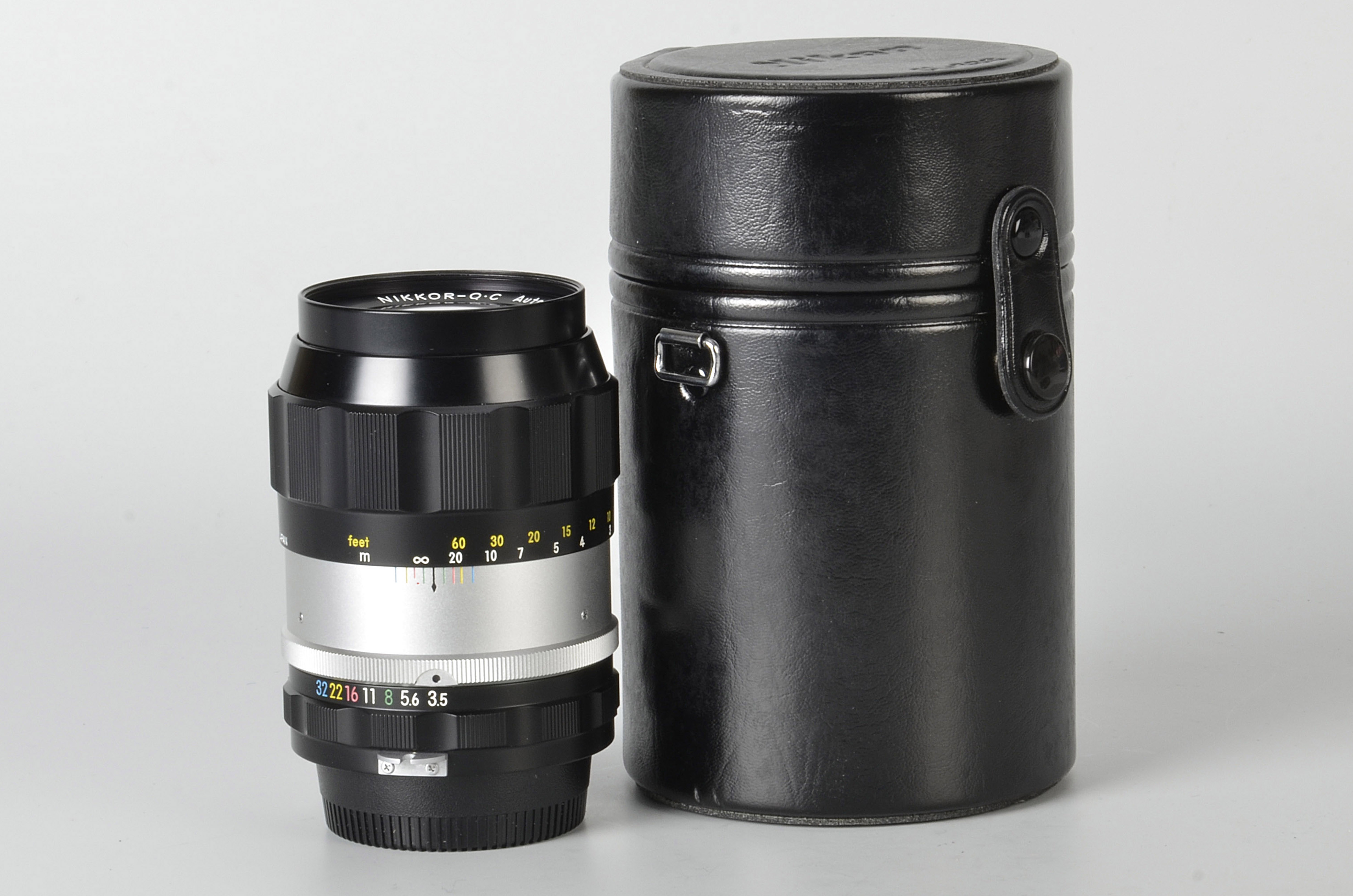 A Nikon Nikkor-Q.C. f/3.5 135mm Lens, black, serial no. 138107, body, VG-E, elements, VG, some