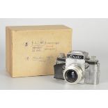 An Ihagee Exa Dummy Model, chrome, serial no. AE0026, with E. Ludwig Meritar f/2.9 50mm lens,