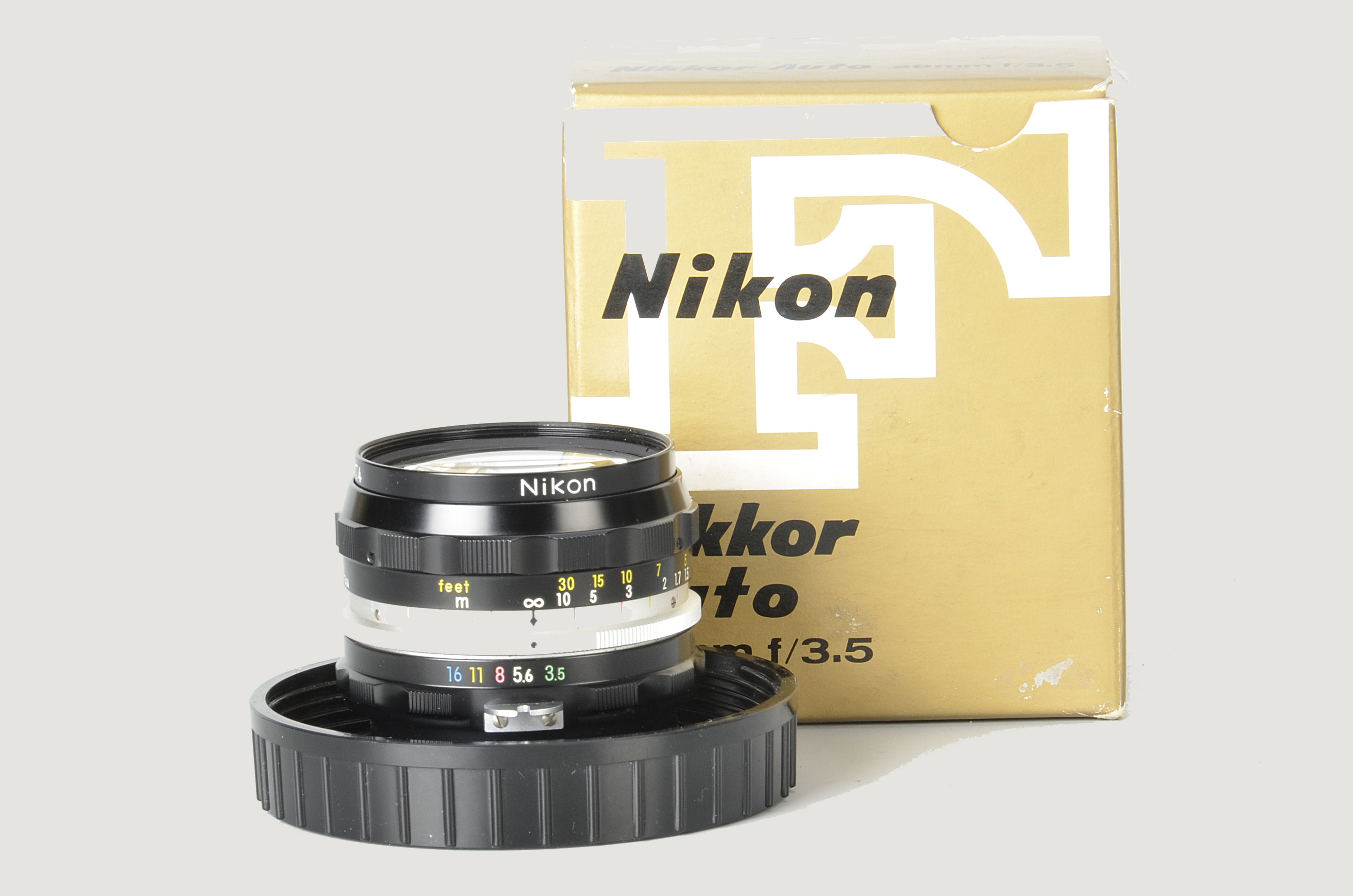 A Nikon Nikkor-H f/3.5 28mm Lens, black, serial no. 782574, body, E, elements, VG-E, in maker’s