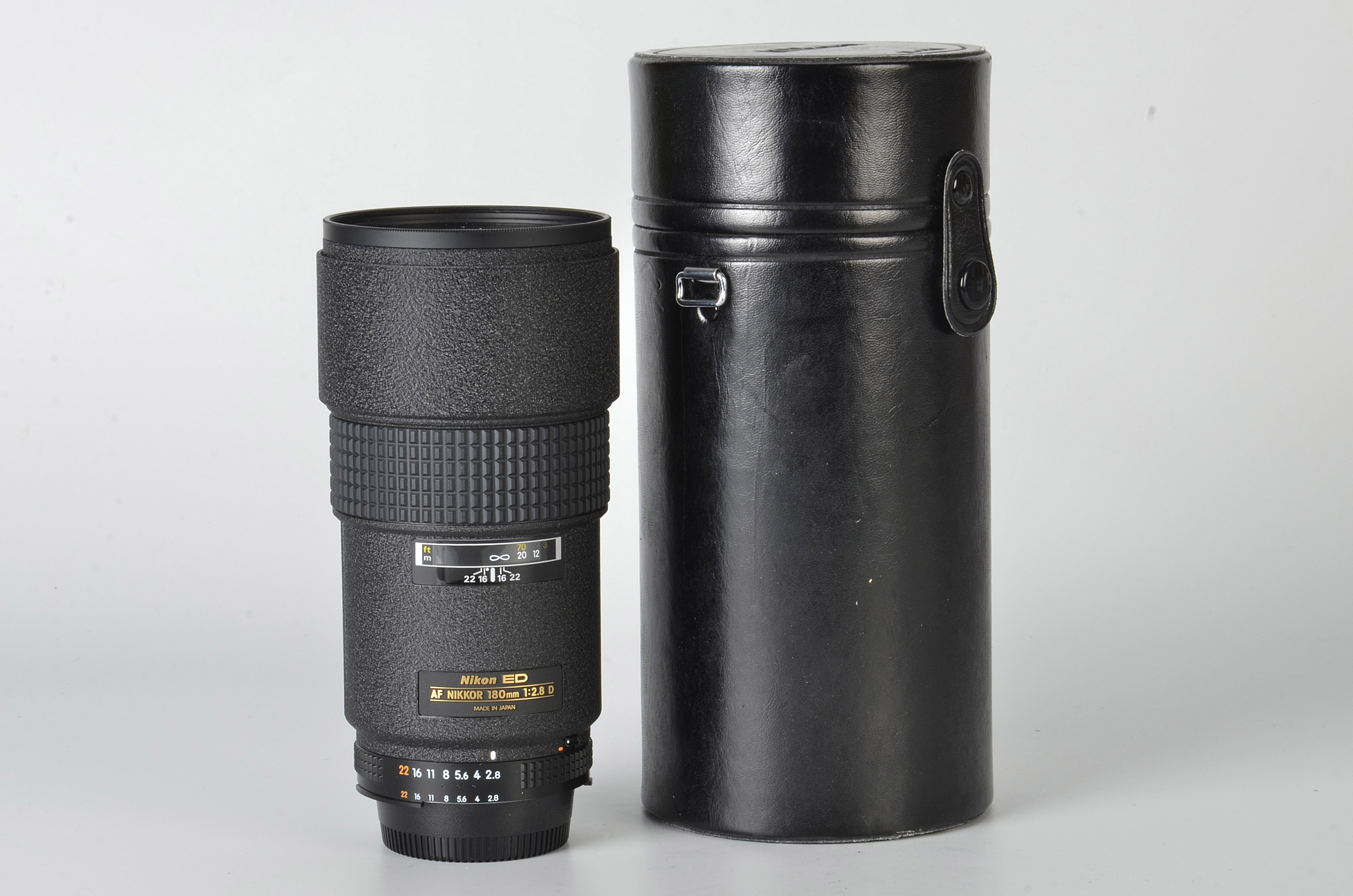 A Nikon AF ED f/2.8 180mm Lens, black, serial no. 414637, body, E, elements, E, in maker’s case