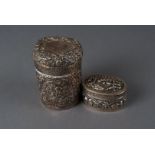 A Victorian period Indian white metal tea canister, with chased and engraved scrolling foliage,