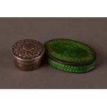 A modern continental silver and enamelled pill box, oval with green and gilt decoration, some
