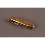 A pretty antique French gold mounted pocket knife, with raised Rococo themed designs, bearing strike