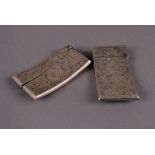 Two Edward VII period silver calling card cases, both curved rectangular form with engraved