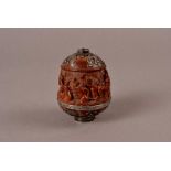 A 19th century continental carved coquille nut desk seal pot, decorated with carved design of