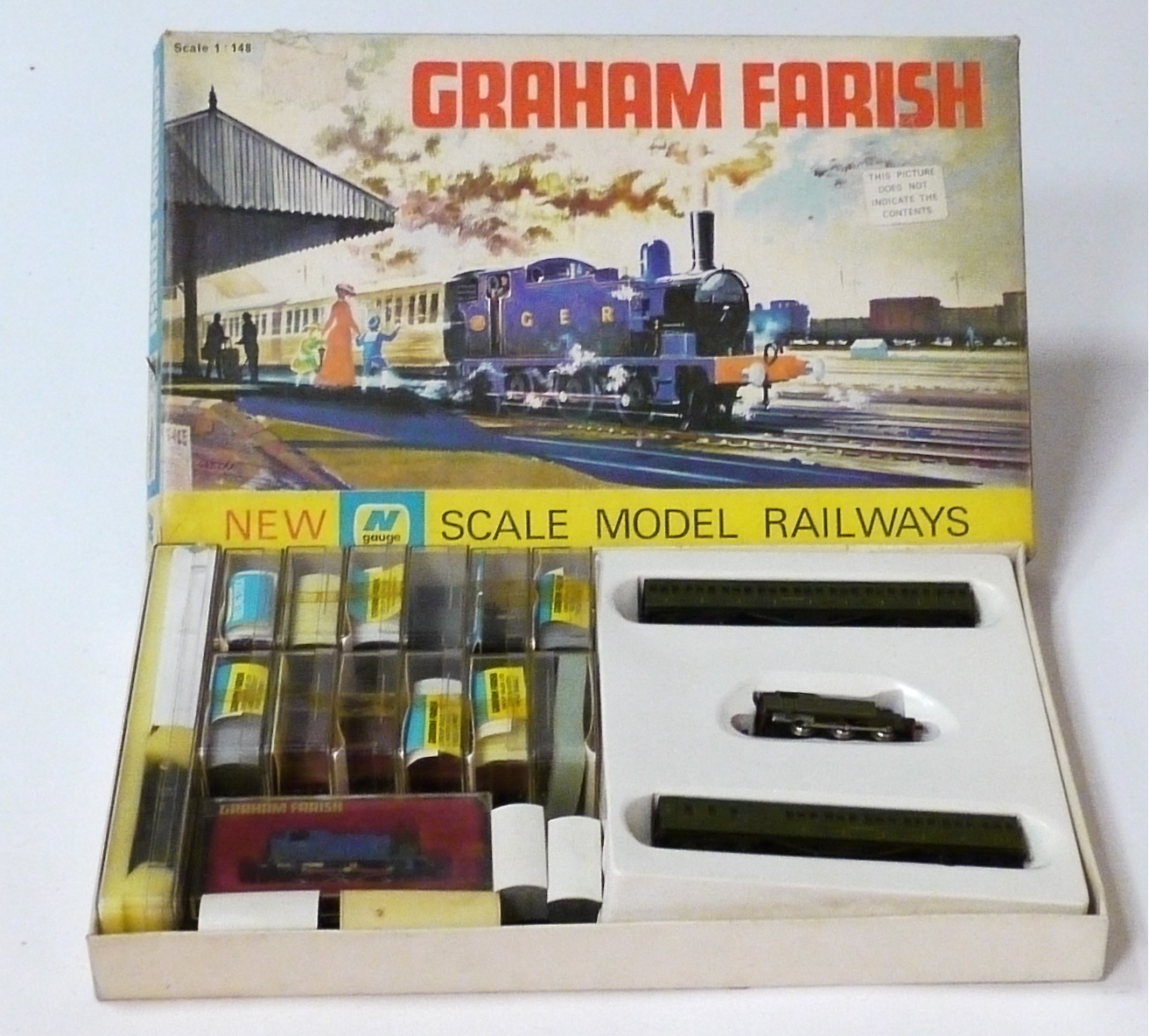 N Gauge Locomotives and Stock by Graham Farish, including SR green 0-6-0T and two coaches in