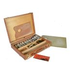 Buddy Holly, a personally owned oil painting set in a light brown wooden case with brown leather