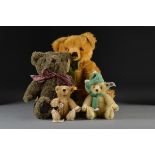 Four manufactured teddy bears: a small Steiff with white tag 0163/19; another Historic Steiff