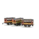 Three Early 0 Gauge Coaches by Bub or Carette, approx 4½” long with pressed clerestory-type roofs,