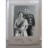 1986 Royal Memorabilia, a formal photograph of the Queen and Prince Phillip, mounted, and signed at