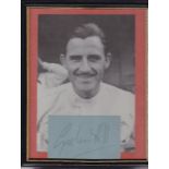 GRAHAM HILL AUTOGRAPH A framed and glazed black & white 9" X 6" photograph of motor racing driver