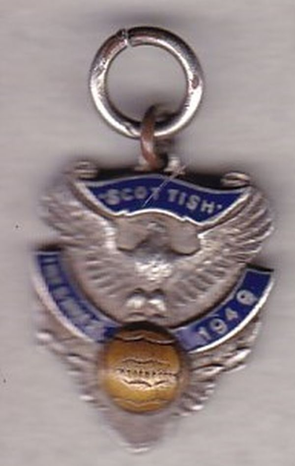 SCOTTISH 1949 Hall-marked silver medal with enamel. Wording reads "Scottish International 1949" .