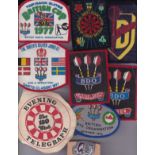 DARTS - BADGES Eight various material badges for the BDO and events in the 1970's plus a dart player