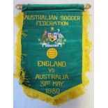 OFFICIAL AUSTRALIA V. ENGLAND 1980 PENNANT Official 17" green pennant with yellow tassels and bar