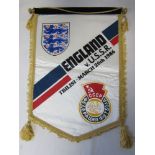 OFFICIAL ENGLAND PENNANT Official 16" white pennant with tassels and bar and chord for the away