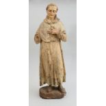 ITALIAN RENAISSANCE CARVED AND PAINTED WOOD FIGURE OF A MONK Modeled with tonsured hair, wearing a